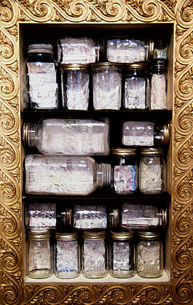 Contained Geographies = Urban Blight, 1994, installation detail<br><br>I cut out the impoverished area of 21 US cities from the maps, place in a jar, and set on the shelf.