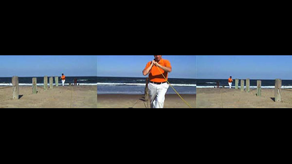 Horizon Line, 2007, video still, three-channel split screen<br><br>Go to menu, click VIDEOS, to watch excerpts<br><br>The action directs the eye to the center, where the yellow rope bisects the horizon line.