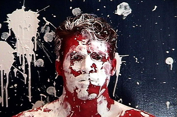 Ideology, 2000, video still<br><br>Go to menu, click VIDEOS, to watch excerpts<br><br>Ideology recontextualizes the modernist myth of the heroic artist’s masculinity. I have taken the action and angst from Jackson Pollock, and incorporated it utilizing the Pollockian Performative to subvert the process of action painting and this myth.