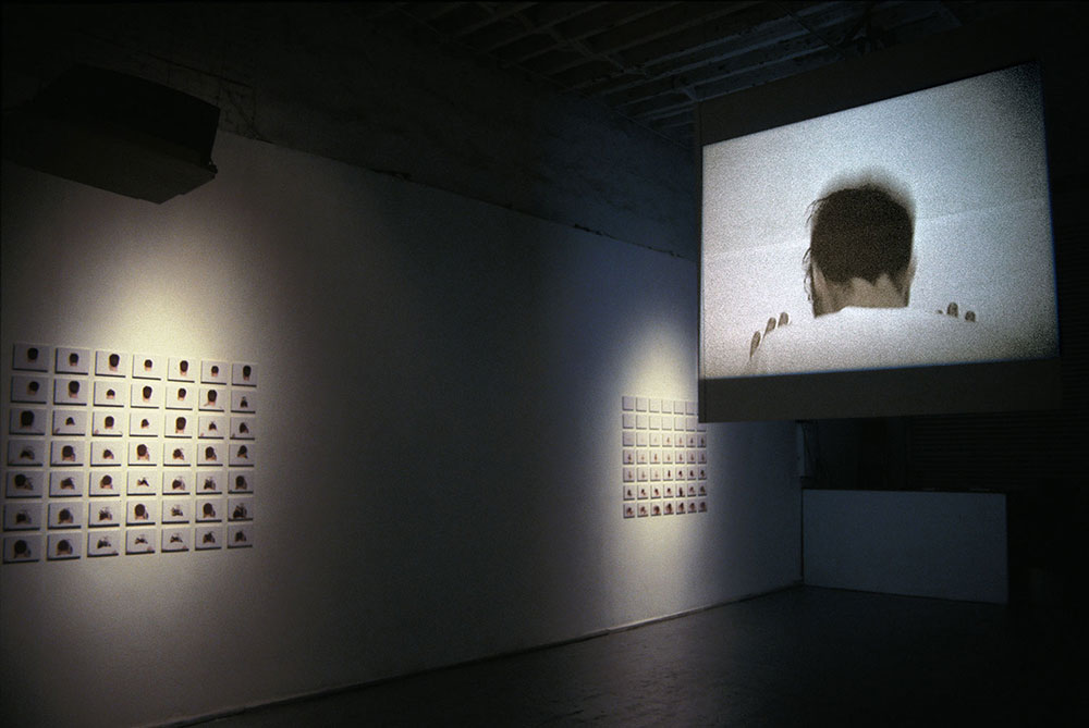 Intellectual Economy, 2002, installation view<br><br>To gain entry into a new space, I bust my head through a wall.