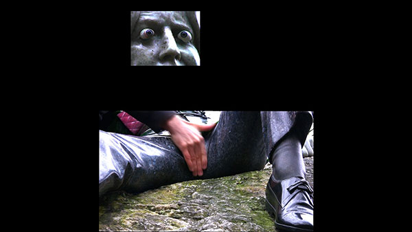 Stroking Wilde, 2012, video still, two-channel split screen<br><br>Go to menu, click VIDEOS, to watch excerpts<br><br>As I watched the tourists line up to snap a picture of Oscar Wilde’s crotch above their heads in Merrion Square Park (Dublin, Ireland), my mind filled with thoughts of mischief.